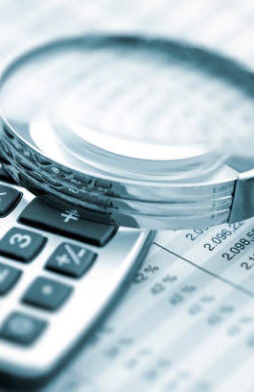 Magnifying glass on financial chart